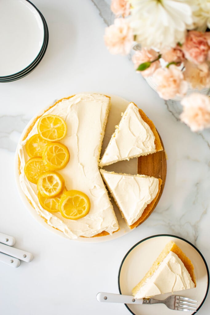 lemon olive oil snack cake with candied lemons on top cut into slices.