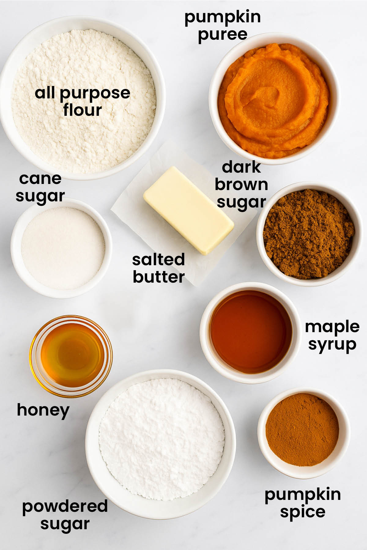 individual ingredients for pumpkin spice pop tarts with pie crust laid out against a white background.