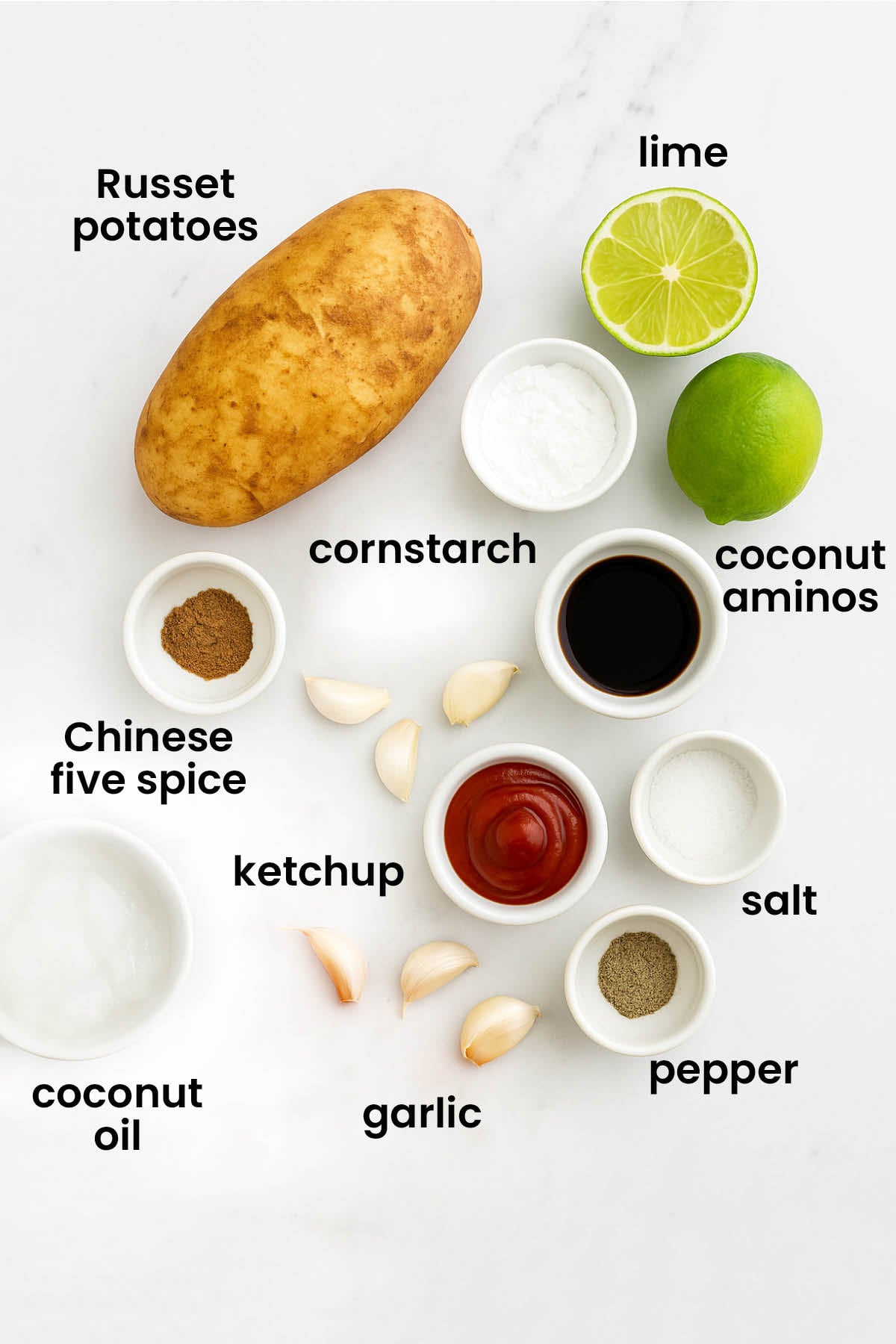 individual ingredients for Chinese five spice garlic French fries laid out against a white background.
