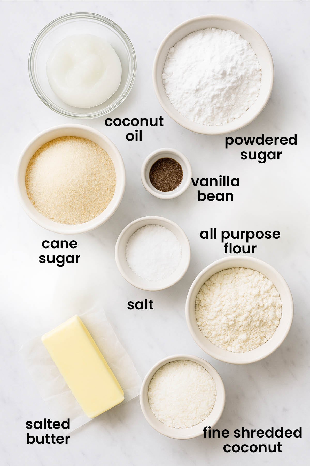 individual ingredients for coconut vanilla bean mini cookies laid out against a white background.