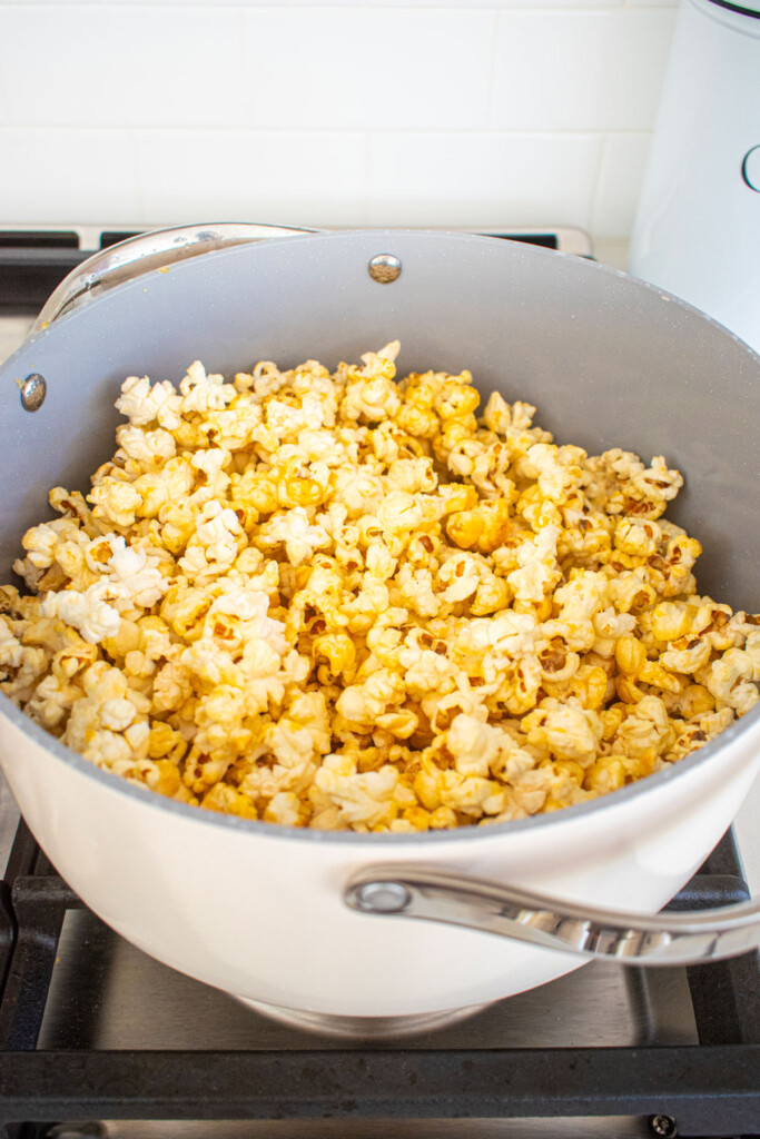 popped kettle corn in a large stockpot on the stovetop.