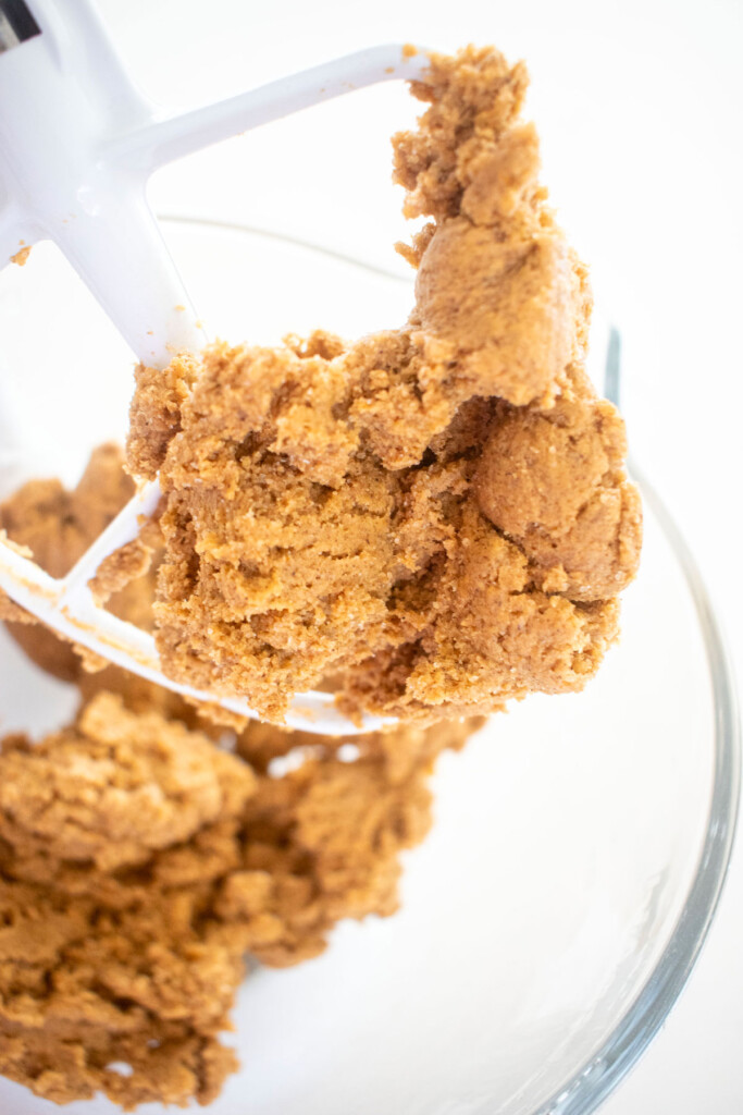 pumpkin spice cookie dough in a glass mixing bowl.