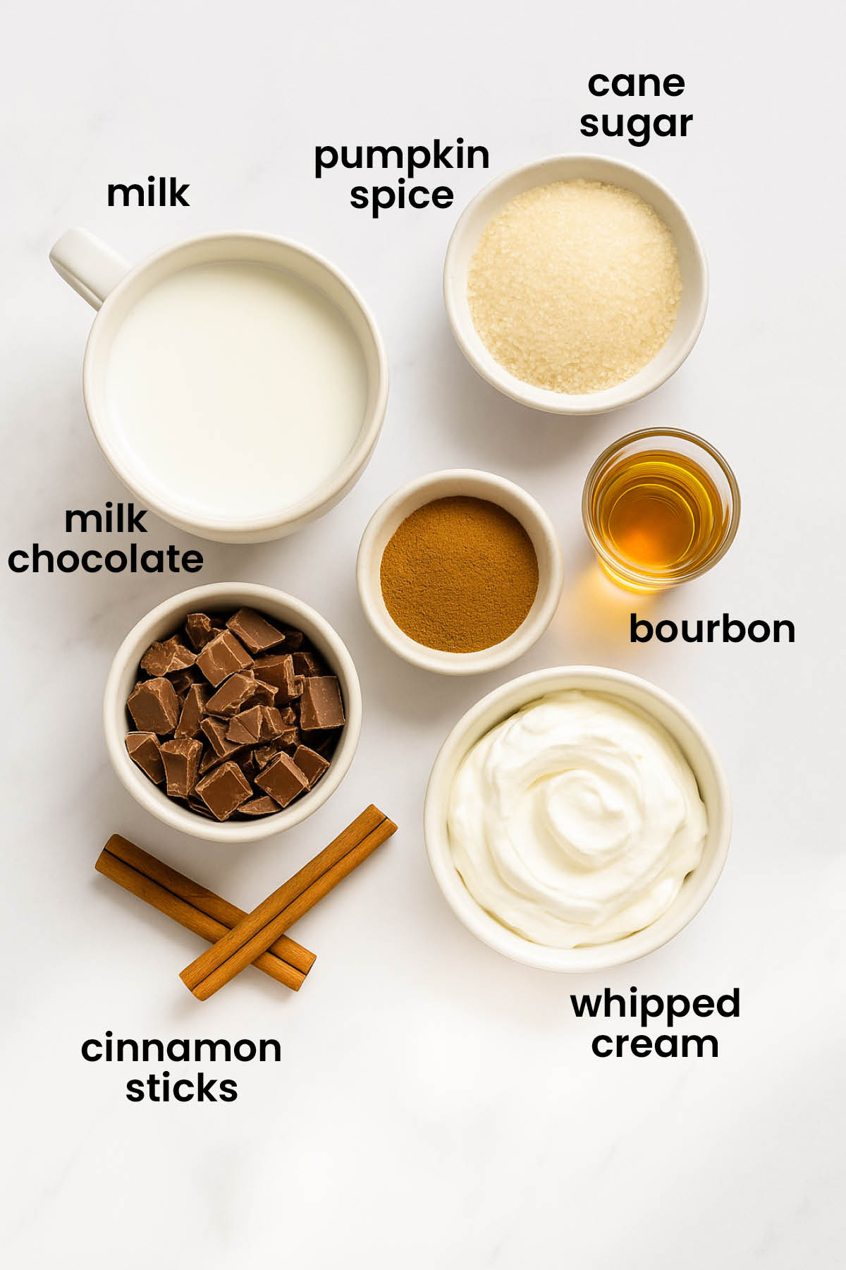 individual ingredients for boozy pumpkin spice hot chocolate laid out against a white background.