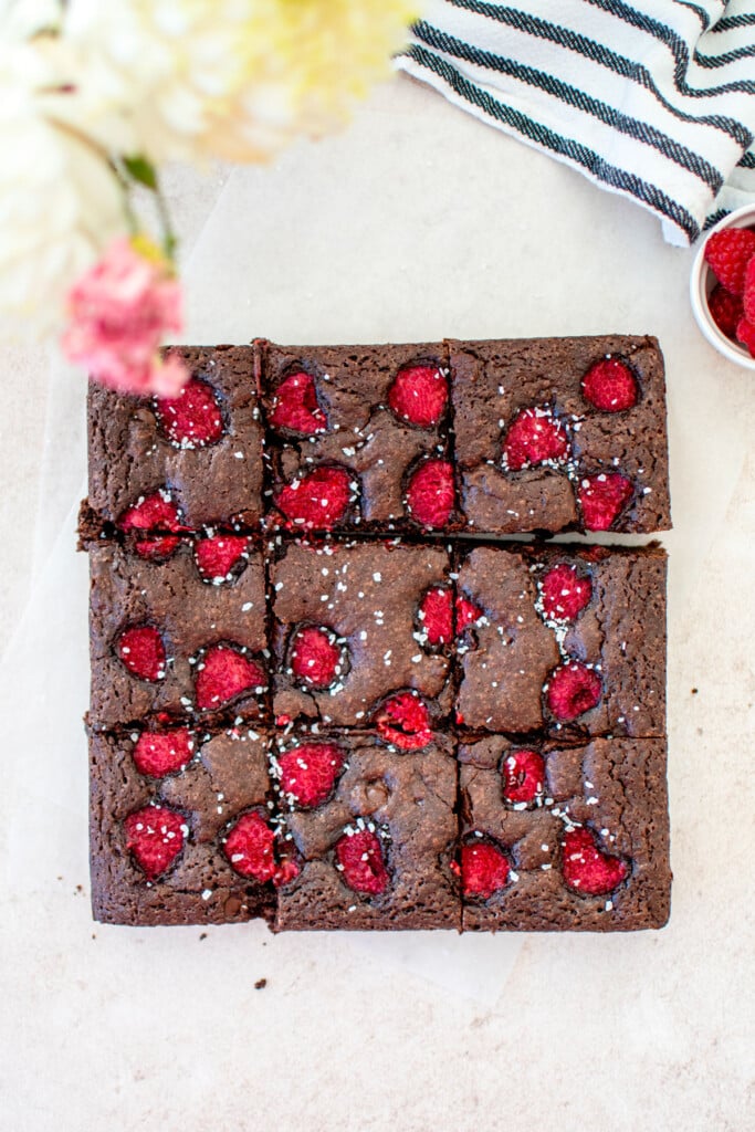 olive oil raspberry brownies cut into 9 squares.