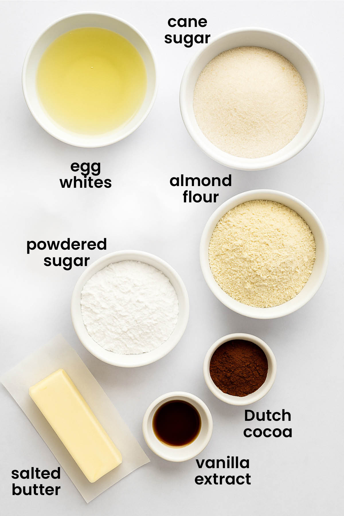 individual ingredients for chocolate malt french macarons laid out against a white background.