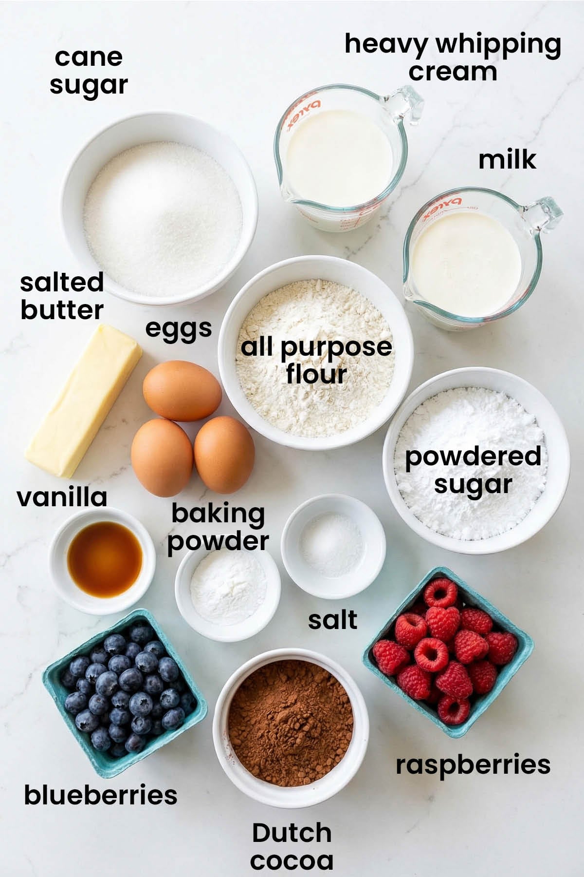 individual ingredients for chocolate berry flag cake with whipped cream frosting laid out against a white background.