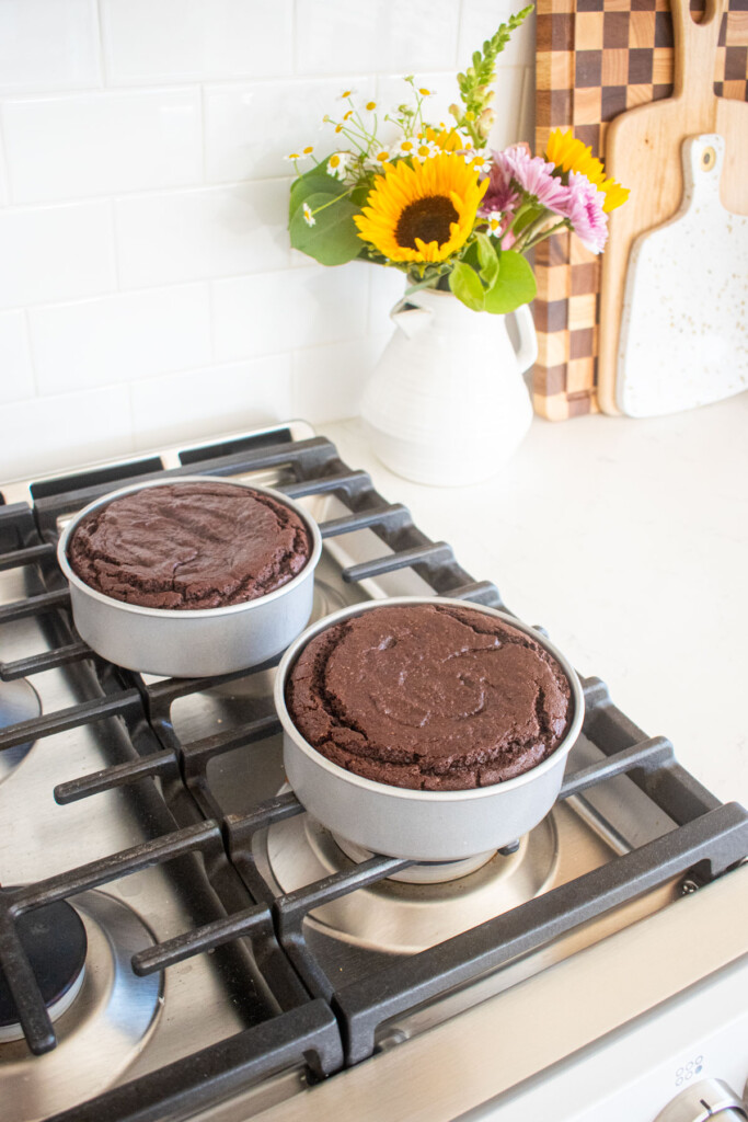 baked vegan sweet potato chocolate cakes baked cooling on top of an oven.