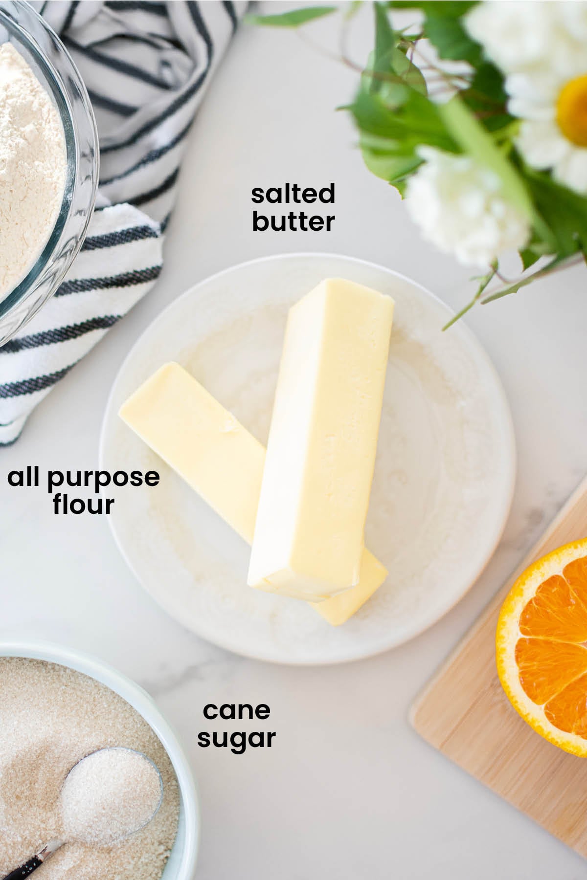 individual ingredients for all butter pie crust laid out against a white background.