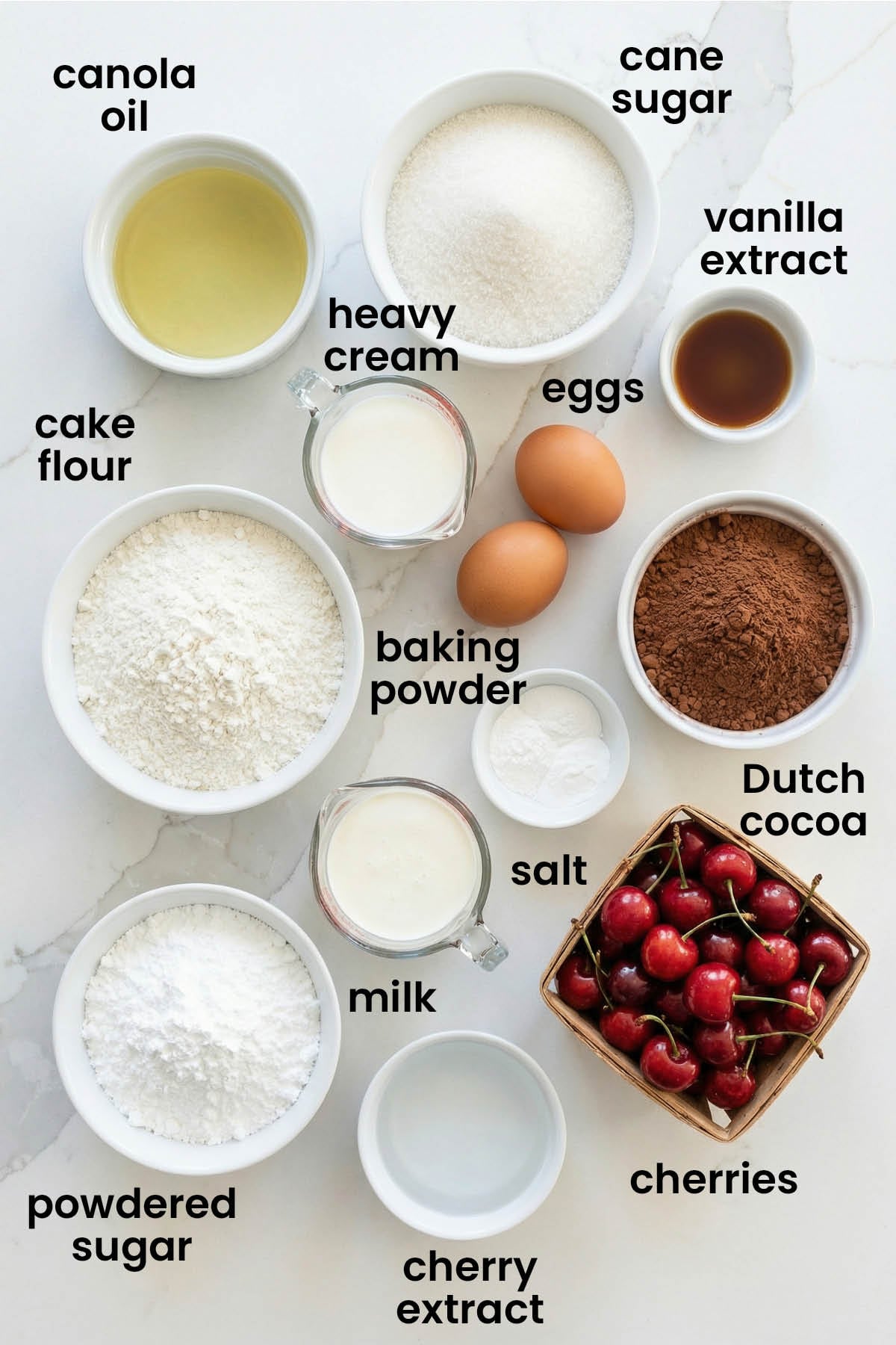 individual ingredients for chocolate cherry whipped cream cake laid out against a white background.