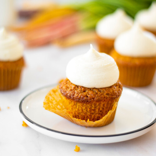 unwrapped brown sugar carrot cupcake on a plate.