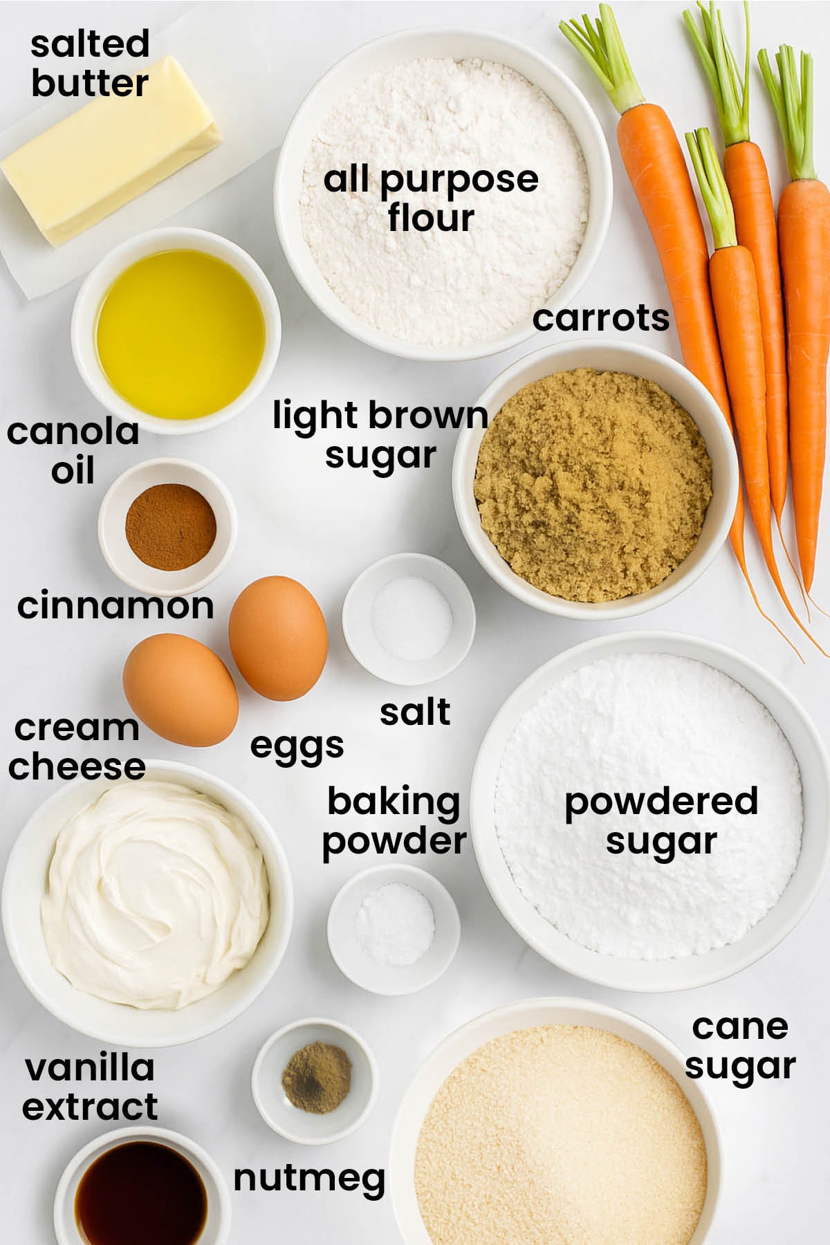 individual ingredients for brown sugar carrot cupcakes laid out against a white background.