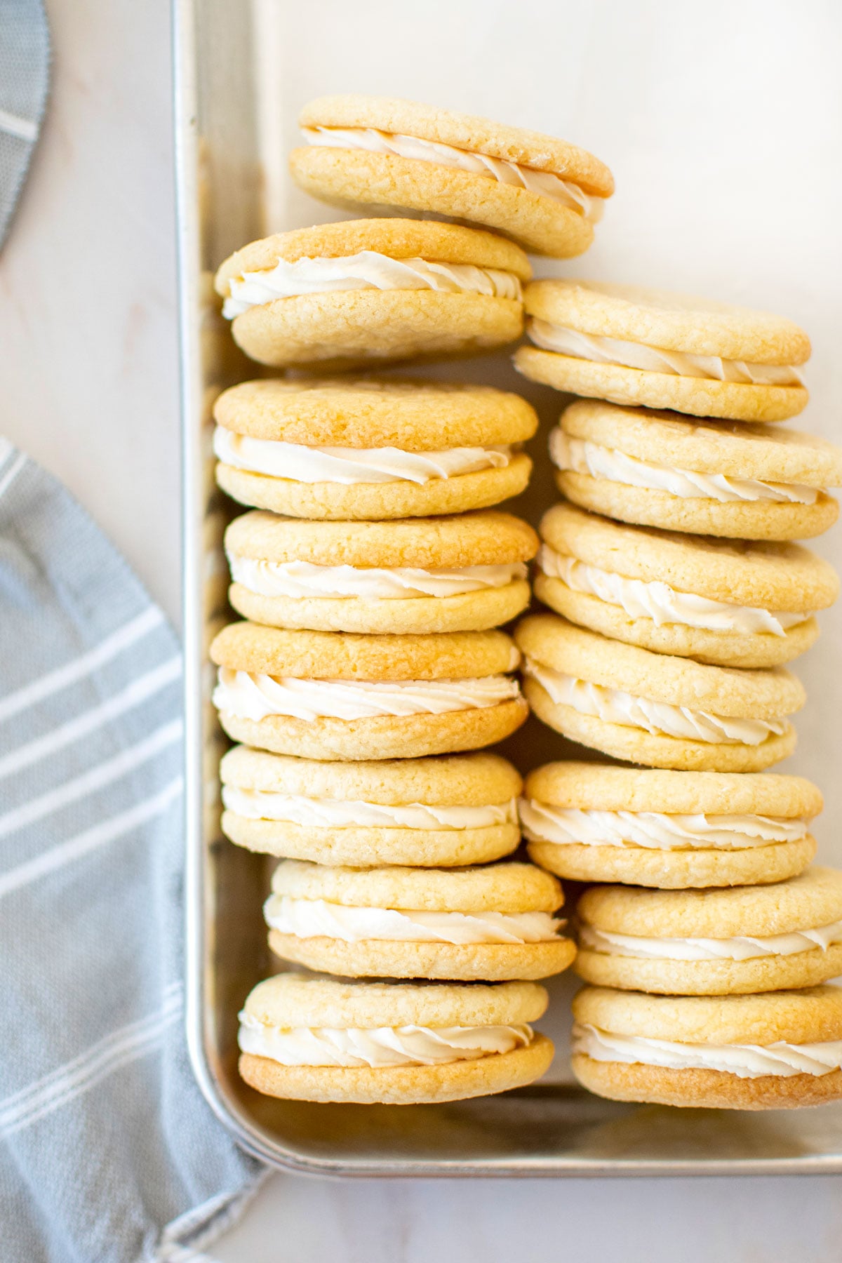 homemade vanilla oreo cookies on a baking sheet.