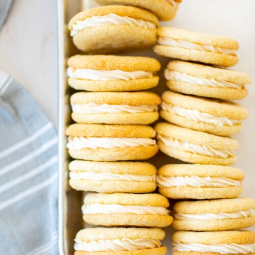 homemade vanilla oreo cookies on a baking sheet.
