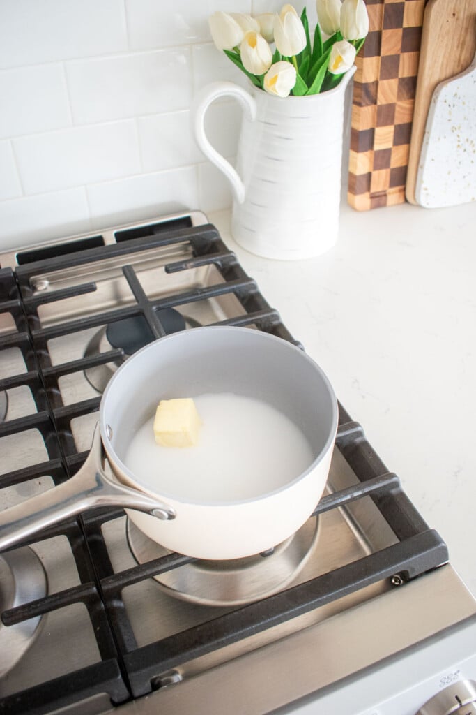 butter and milk in a small pot on the stovetop.