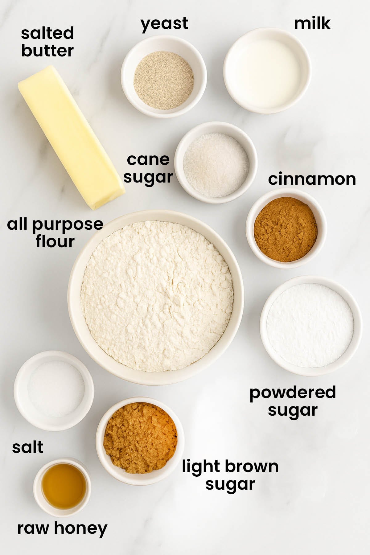 individual ingredients for small batch honey butter cinnamon rolls laid out against a white background.