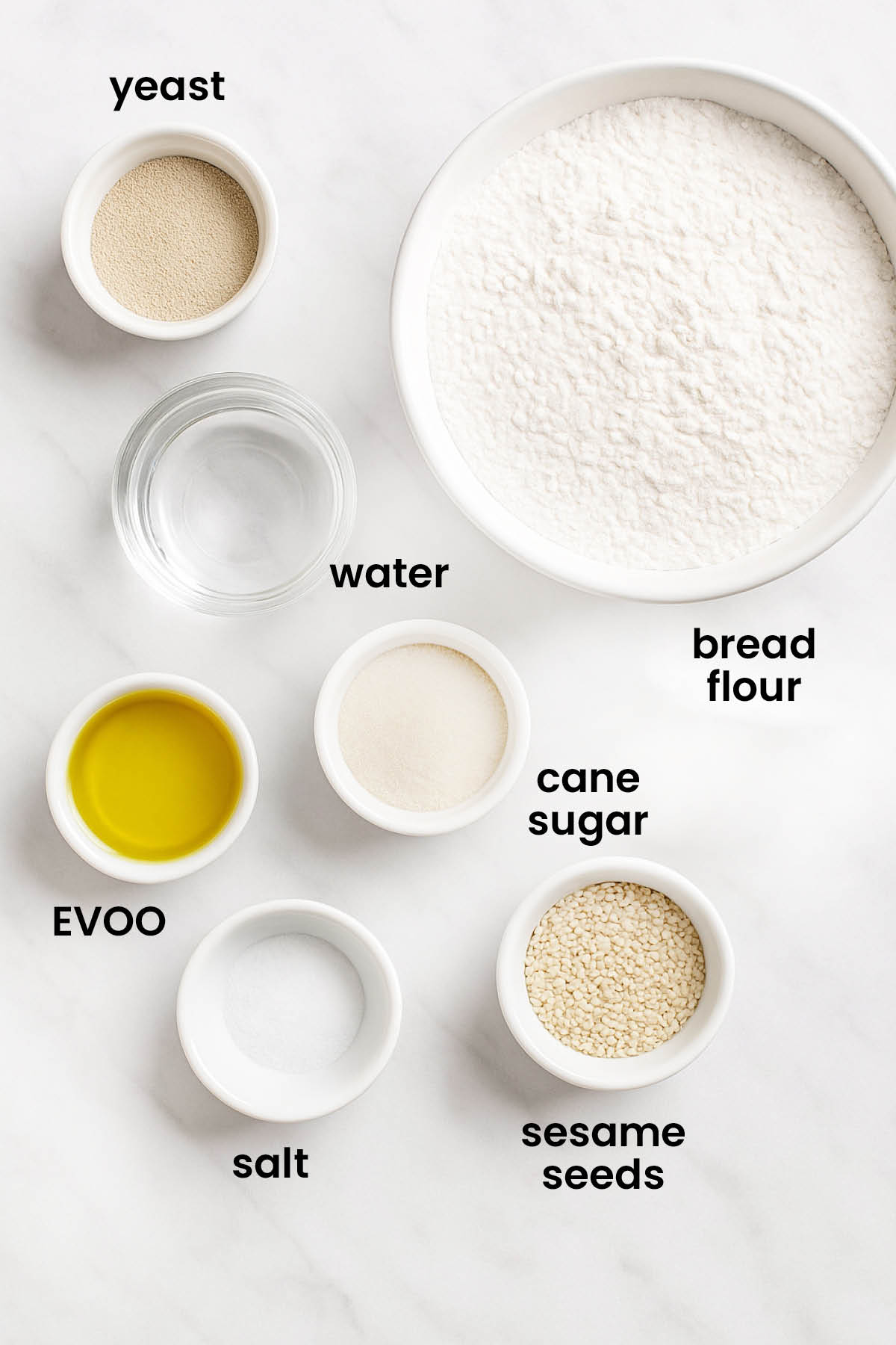individual ingredients for soft white hamburger buns laid out against a white background.