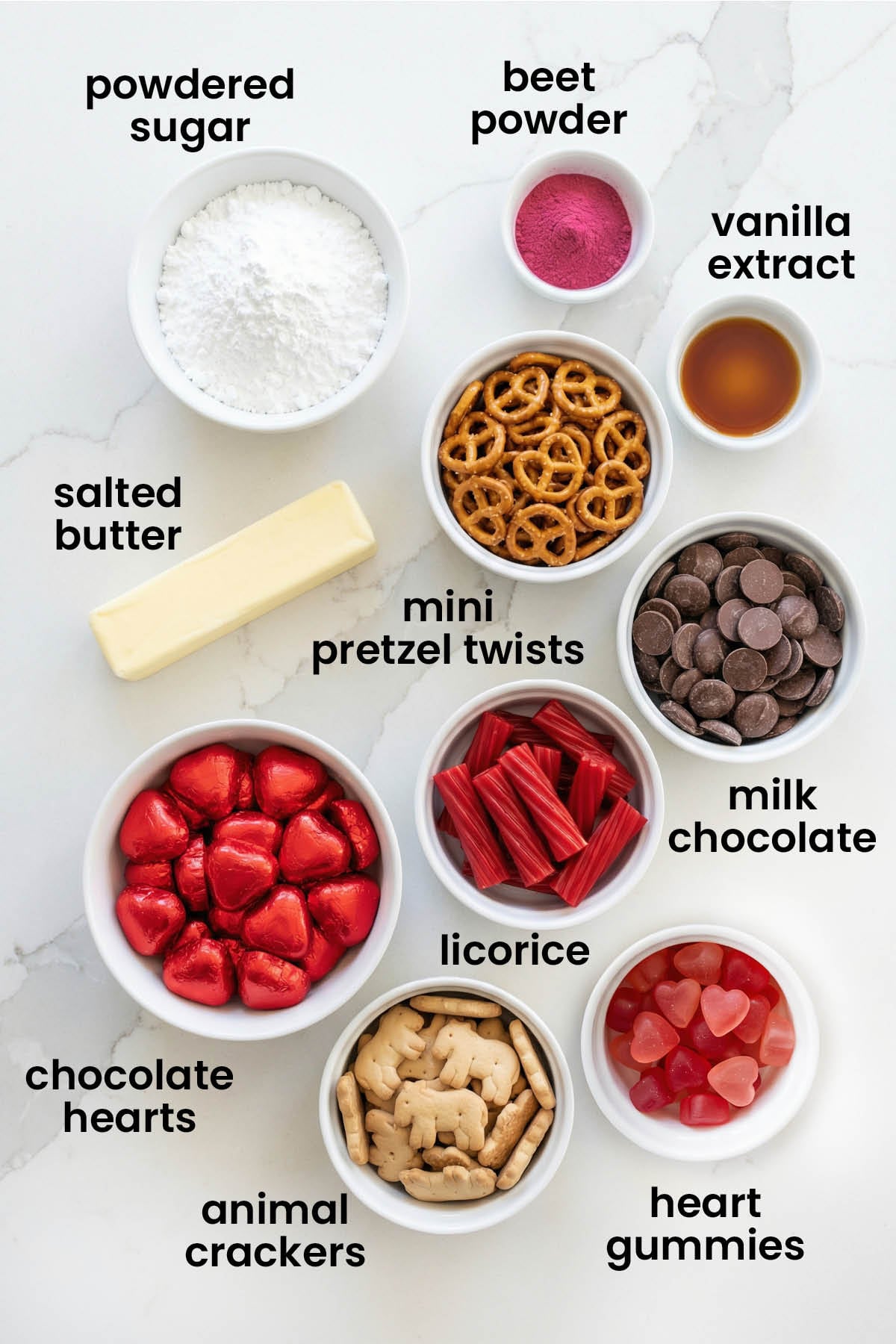 individual ingredients for Valentine's Day charcuterie board laid out against a white background.