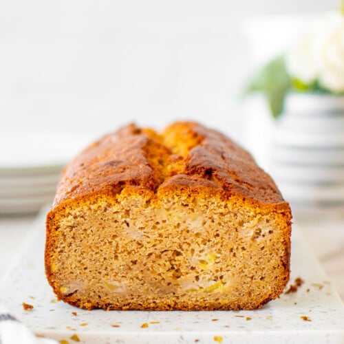 almond butter banana bread on a white marble board.