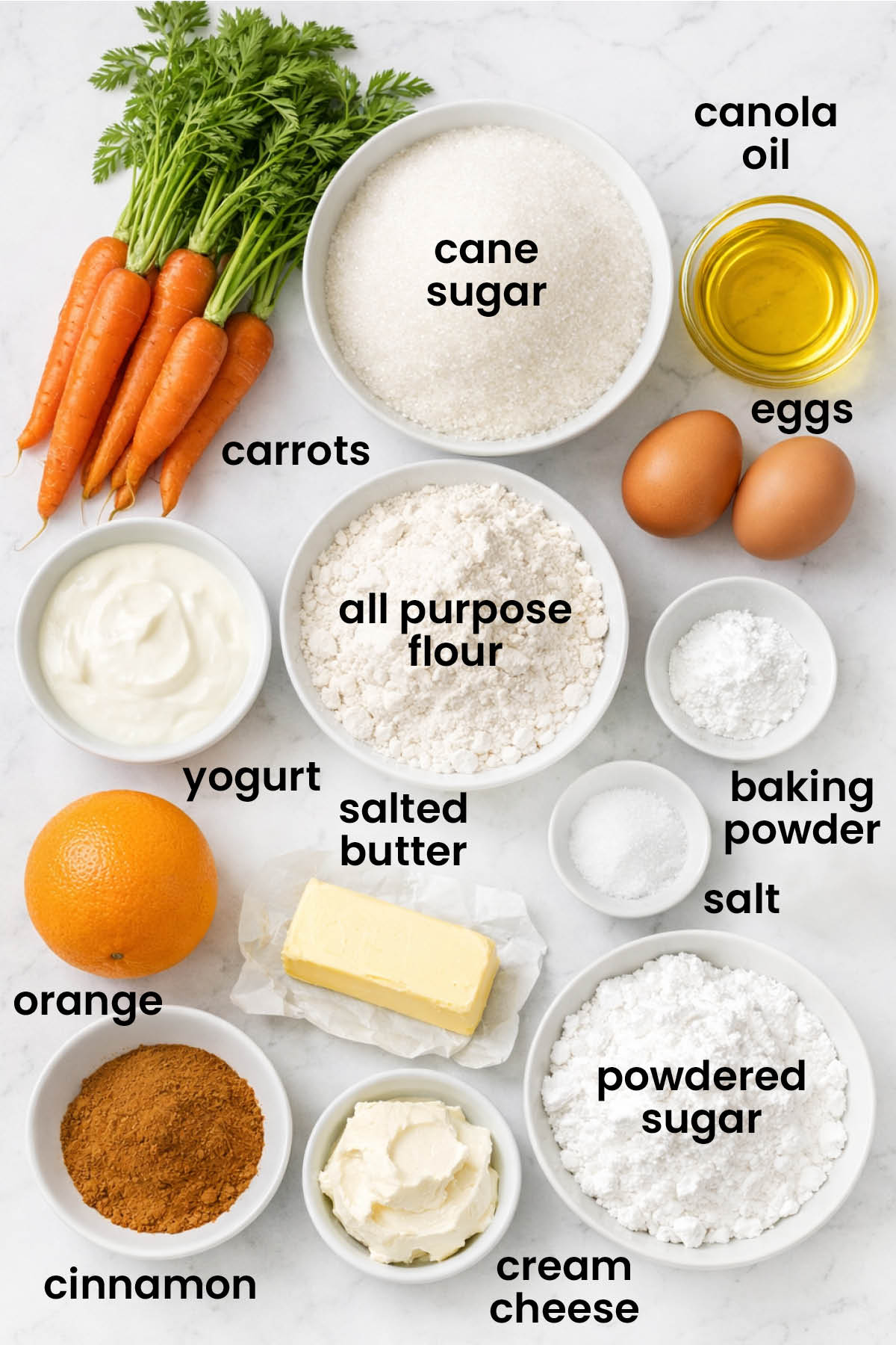 individual ingredients for orange ginger carrot cake laid out against a white background.