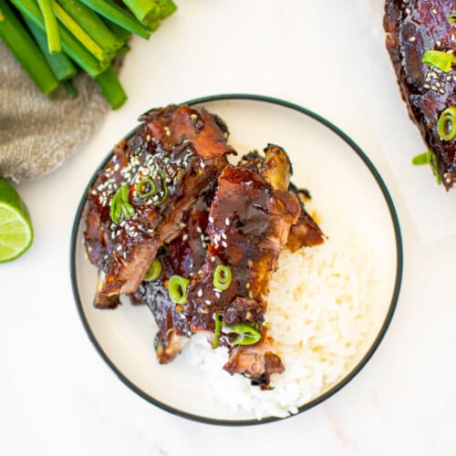 sweet chili baby back ribs on a plate with rice.