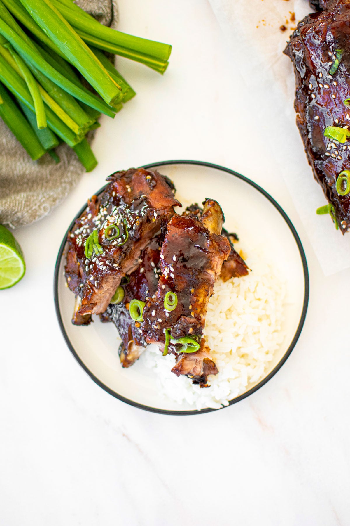 sweet chili baby back ribs on a plate with rice.