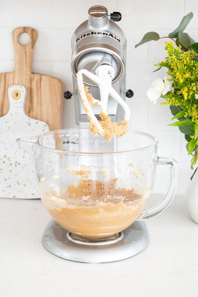 butter and sugar creamed together in a stand mixer on the counter.