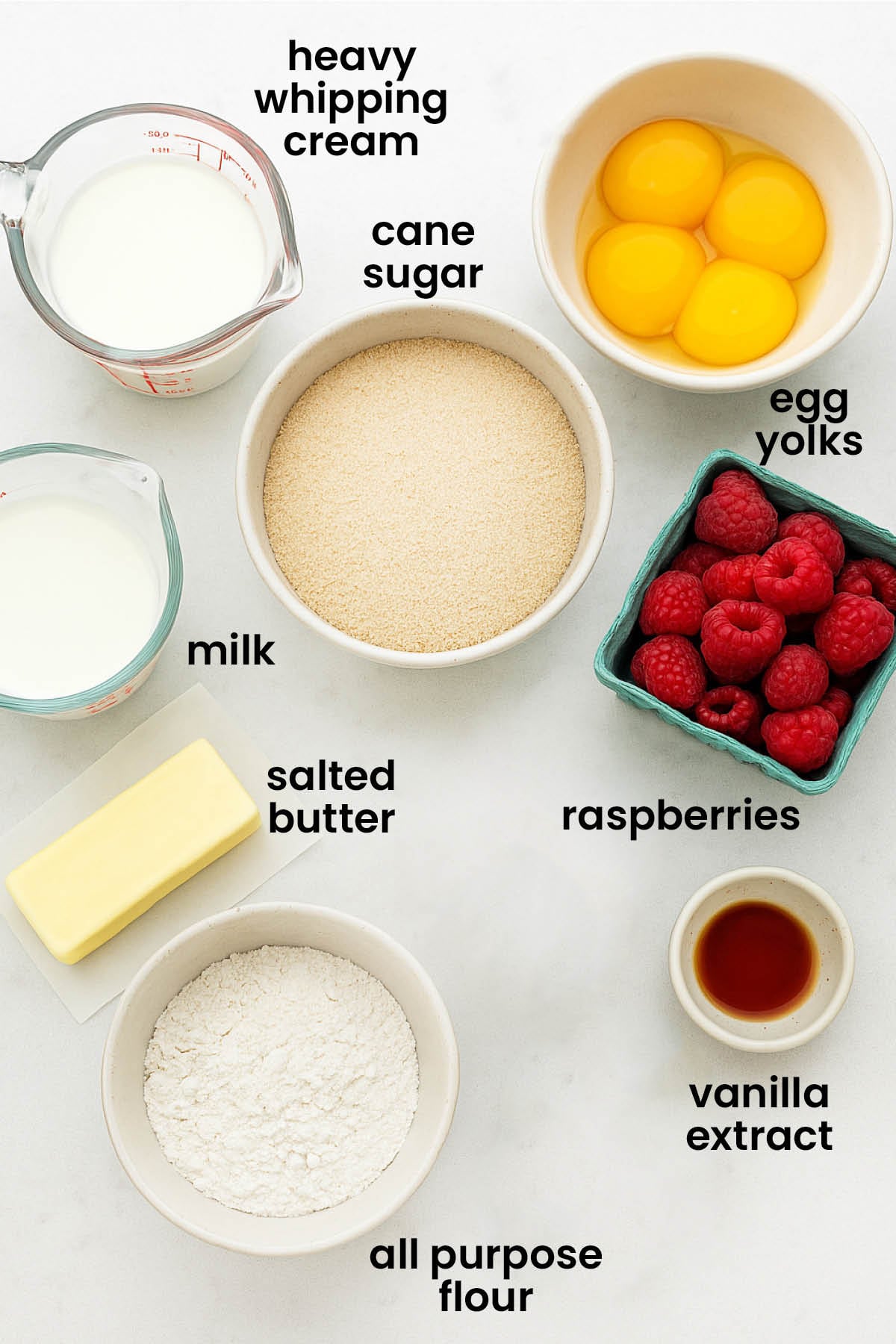 individual ingredients for fresh raspberry custard laid out against a white background.
