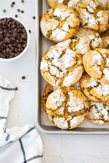 chocolate chip crinkle cookies on a baking sheet.