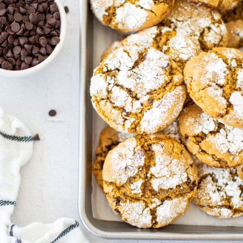 chocolate chip crinkle cookies on a baking sheet.