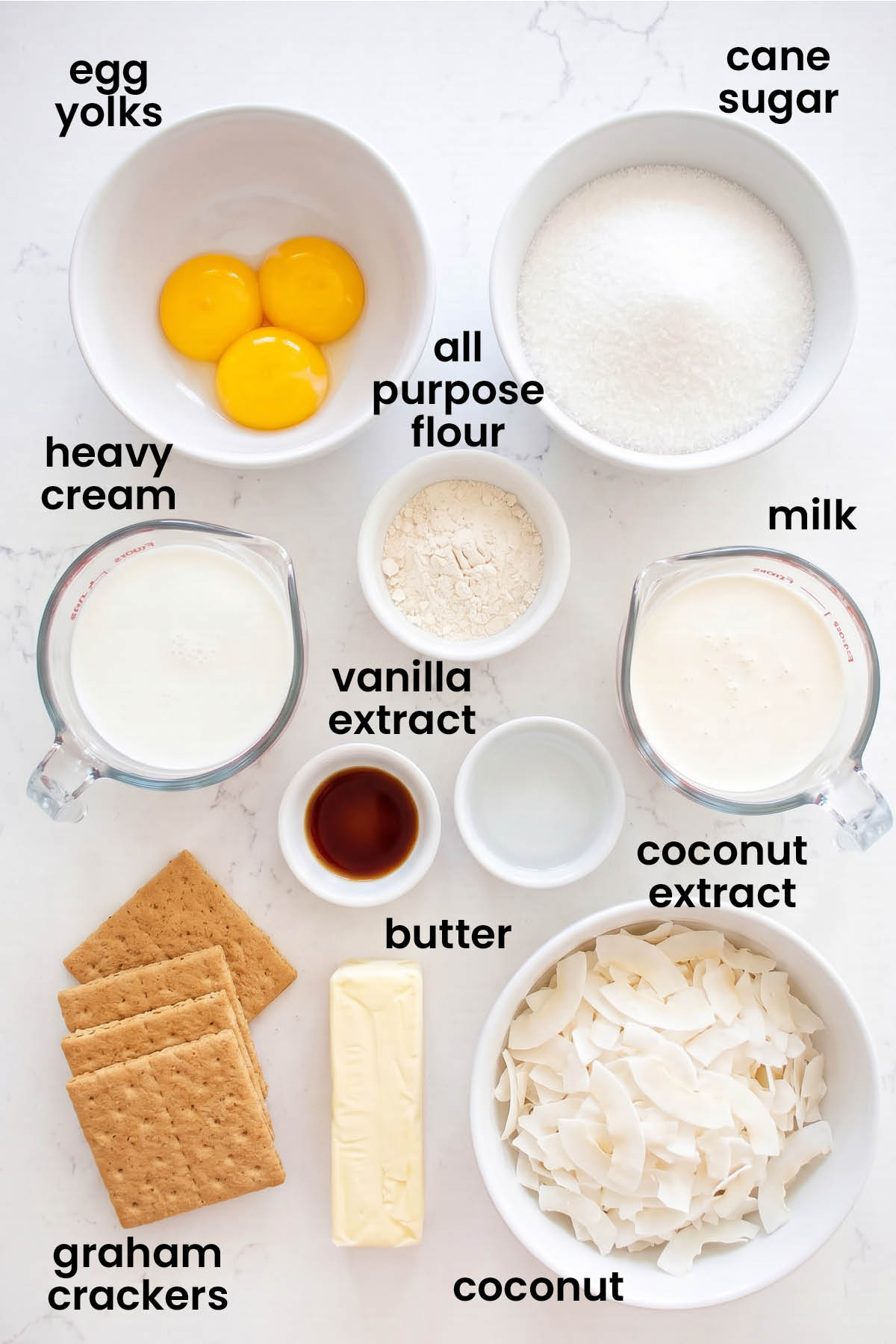 individual ingredients for coconut sweet cream pie laid out against a white background.