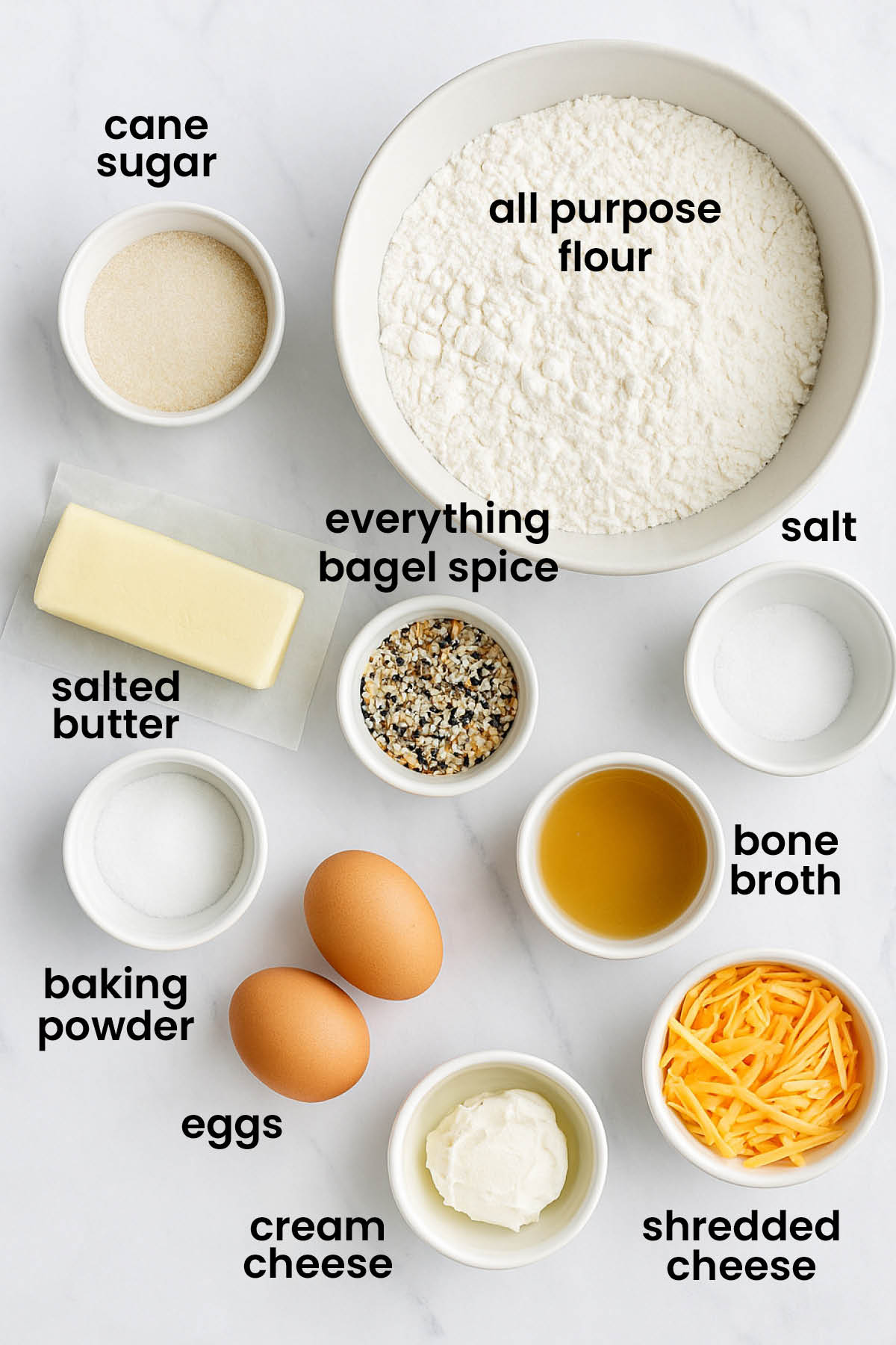 individual ingredients for everything bagel scones laid out against a white background.