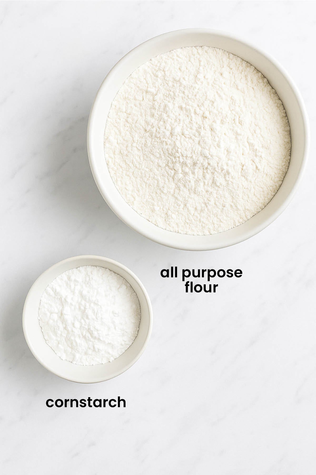 individual ingredients for homemade organic cake flour laid out against a white background.
