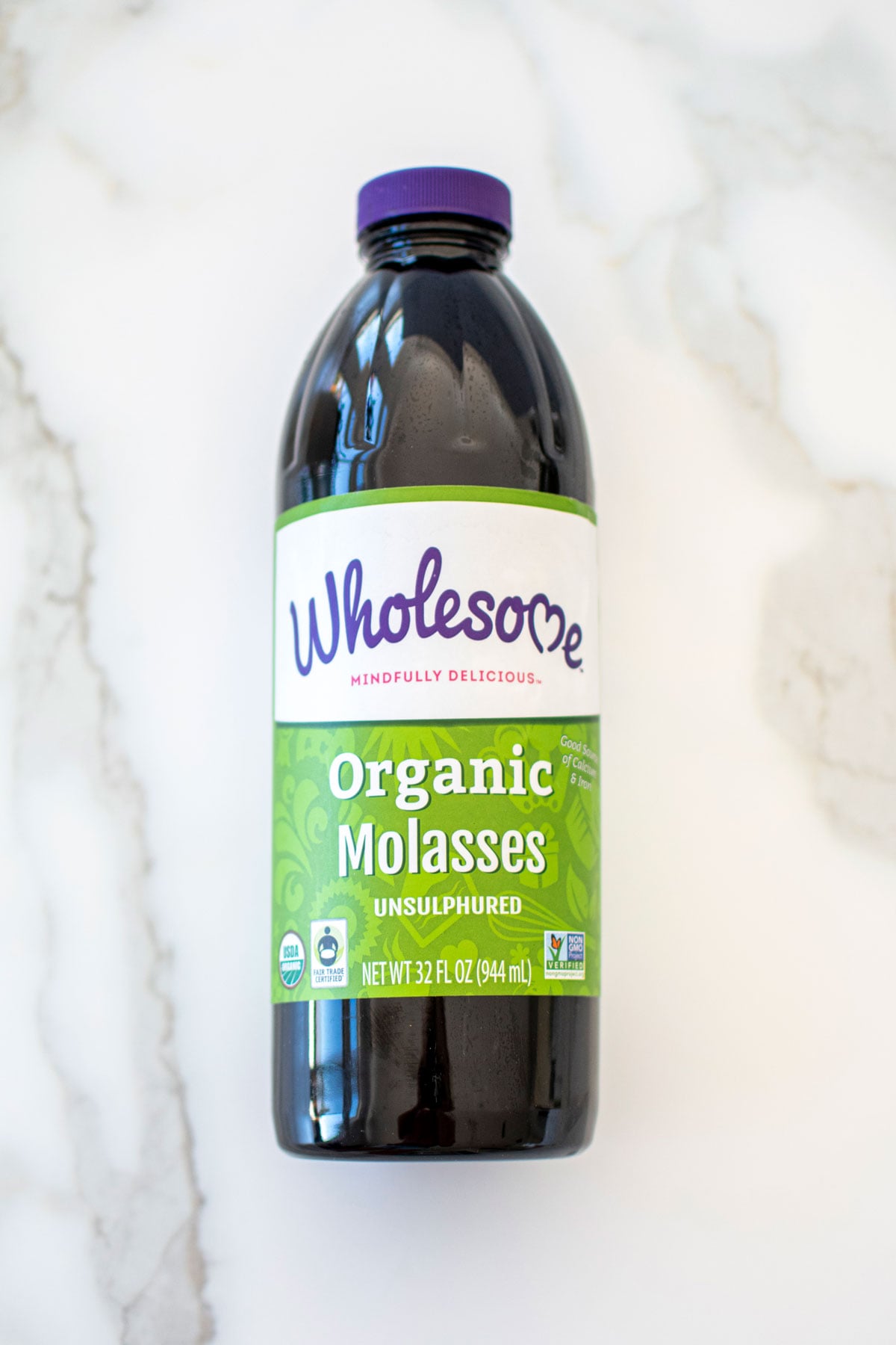 wholesome blackstrap molasses on a marble counter.