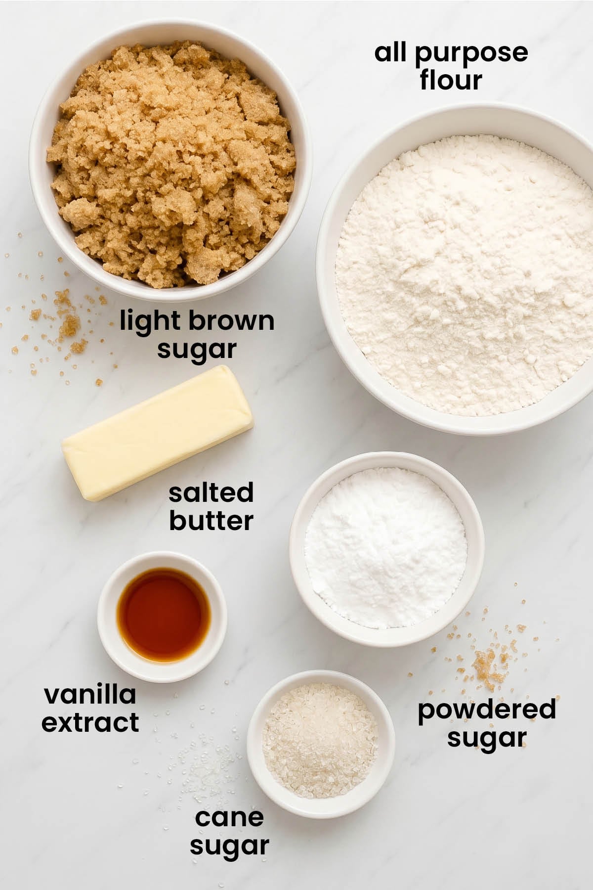 individual ingredients for brown sugar shortbread cookies laid out against a white background.