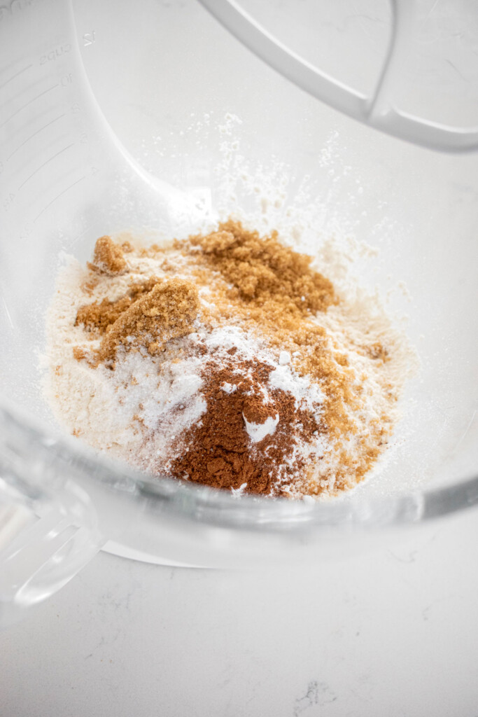 dry ingredients for eggless pumpkin spice scones in a glass mixing bowl.