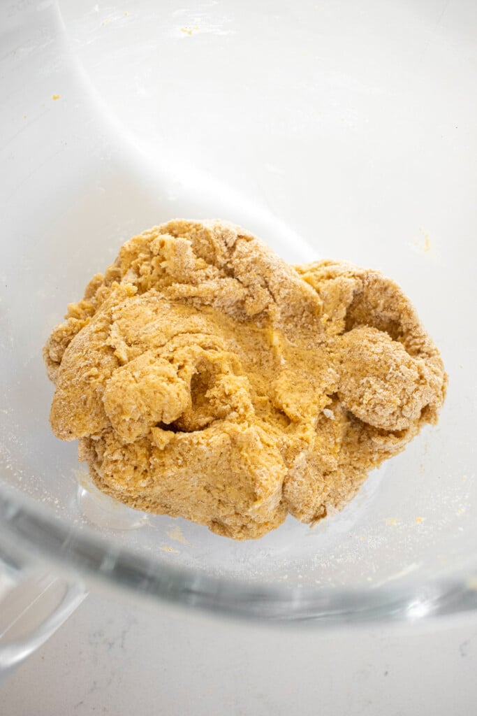 eggless pumpkin spice scone dough in a glass mixing bowl.