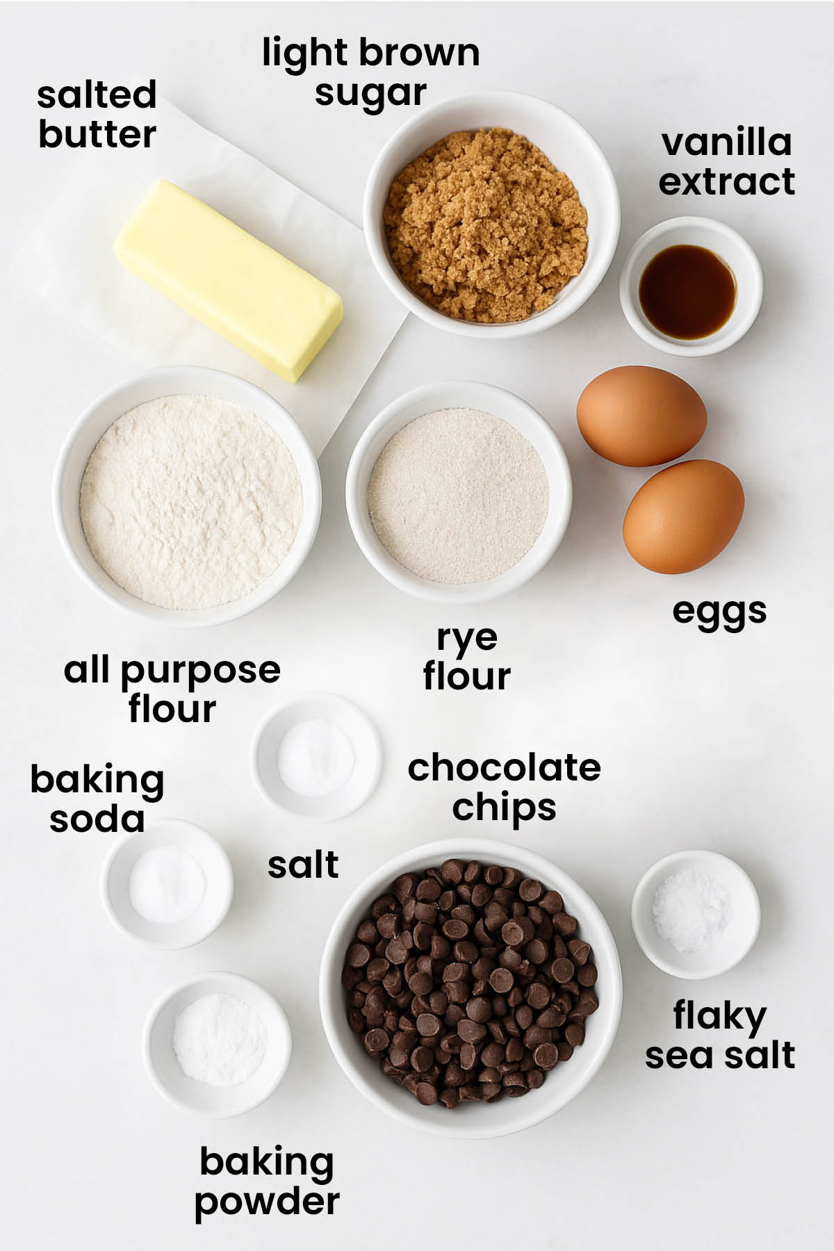 individual ingredients for chewy rye chocolate chip cookies laid out against a white background.