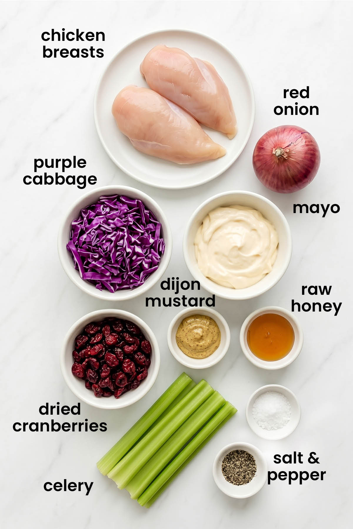 individual ingredients for healthy honey chicken salad laid out against a white background.