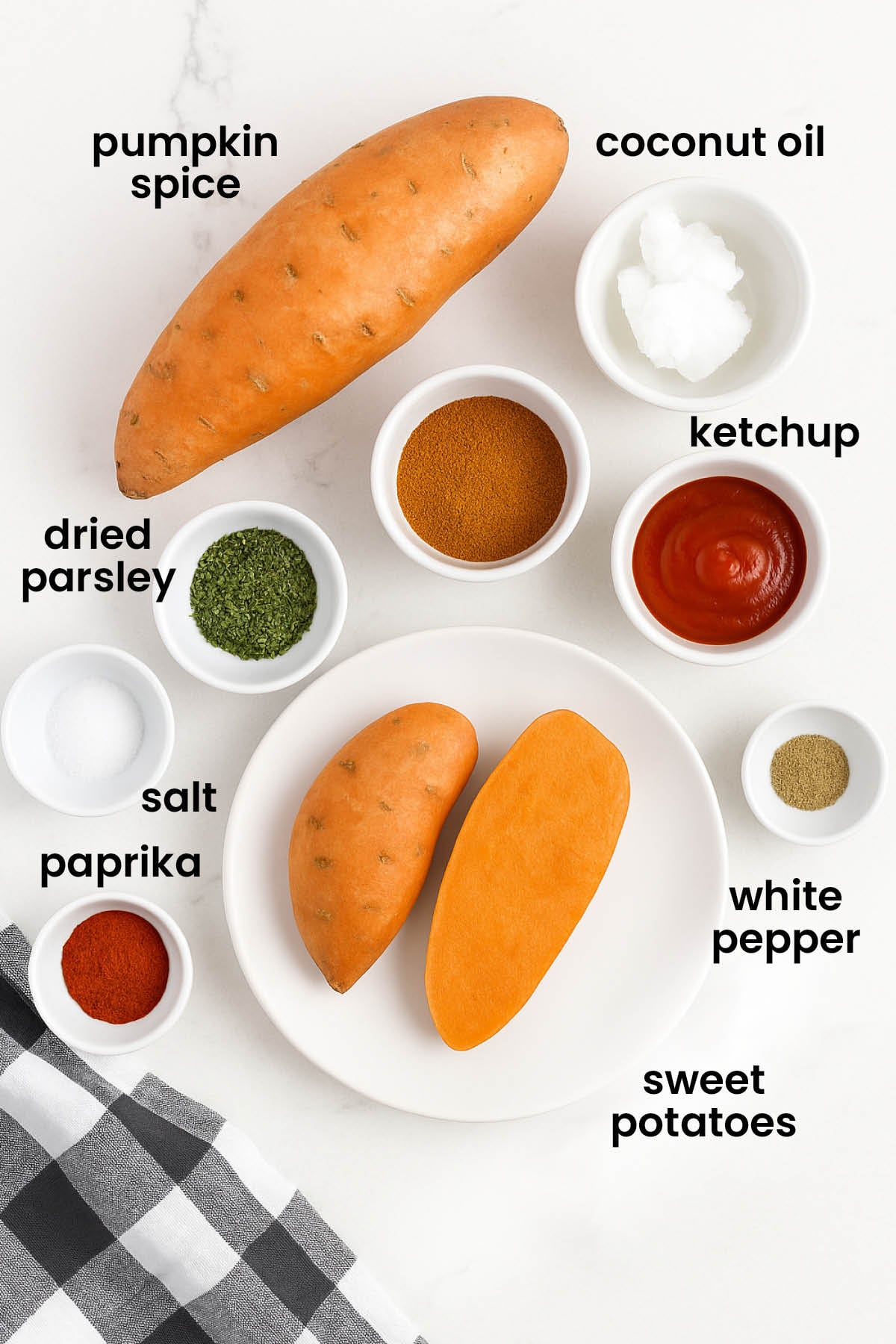 individual ingredients for pumpkin spice sweet potato fries out against a white background.