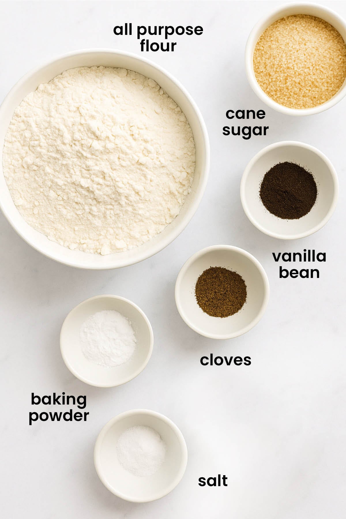 individual ingredients for homemade pancake mix laid out against a white background.