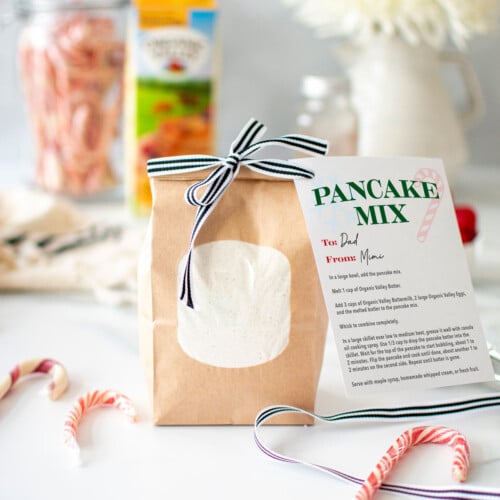 homemade pancake mix in a brown bag with a ribbon and card attached.