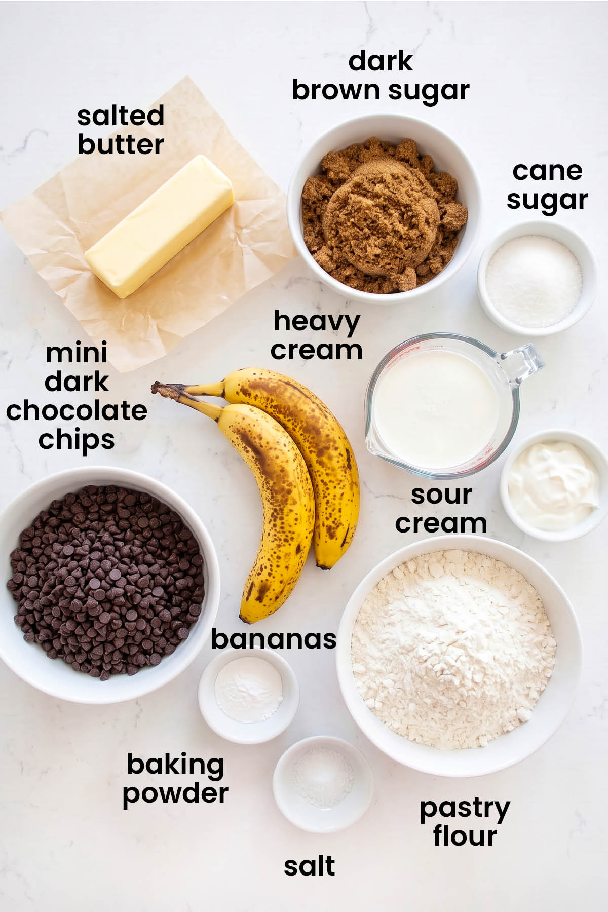 individual ingredients for eggless mini chocolate chip banana bread laid out against a white background.