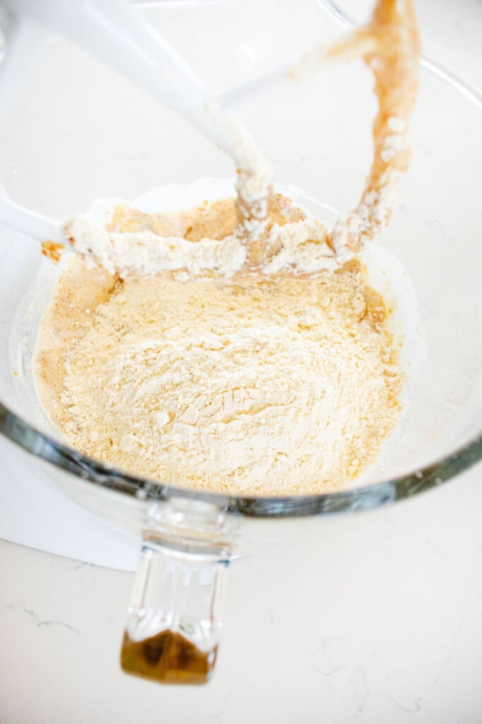ingredients for eggless mini chocolate chip banana bread in a glass mixing bowl.