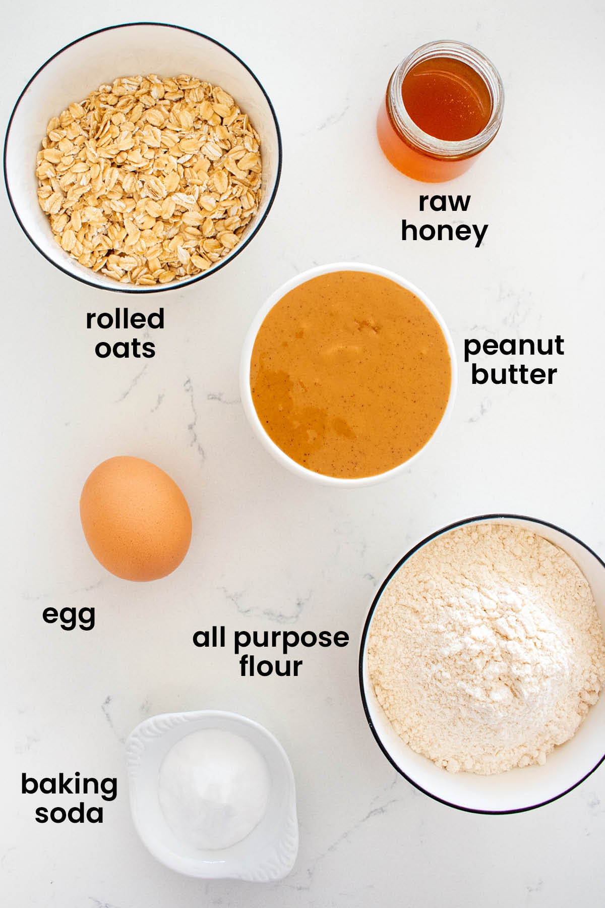 individual ingredients for soft peanut butter dog cookies laid out against a white background.