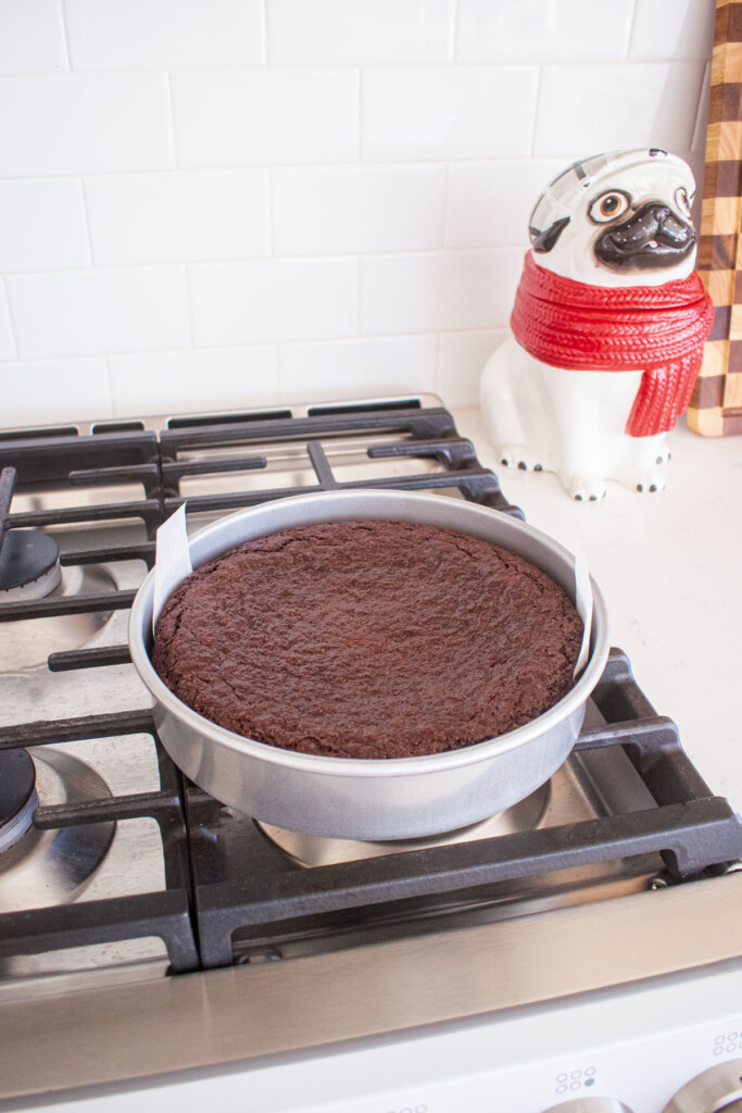 chocolate cake cooling on an oven.