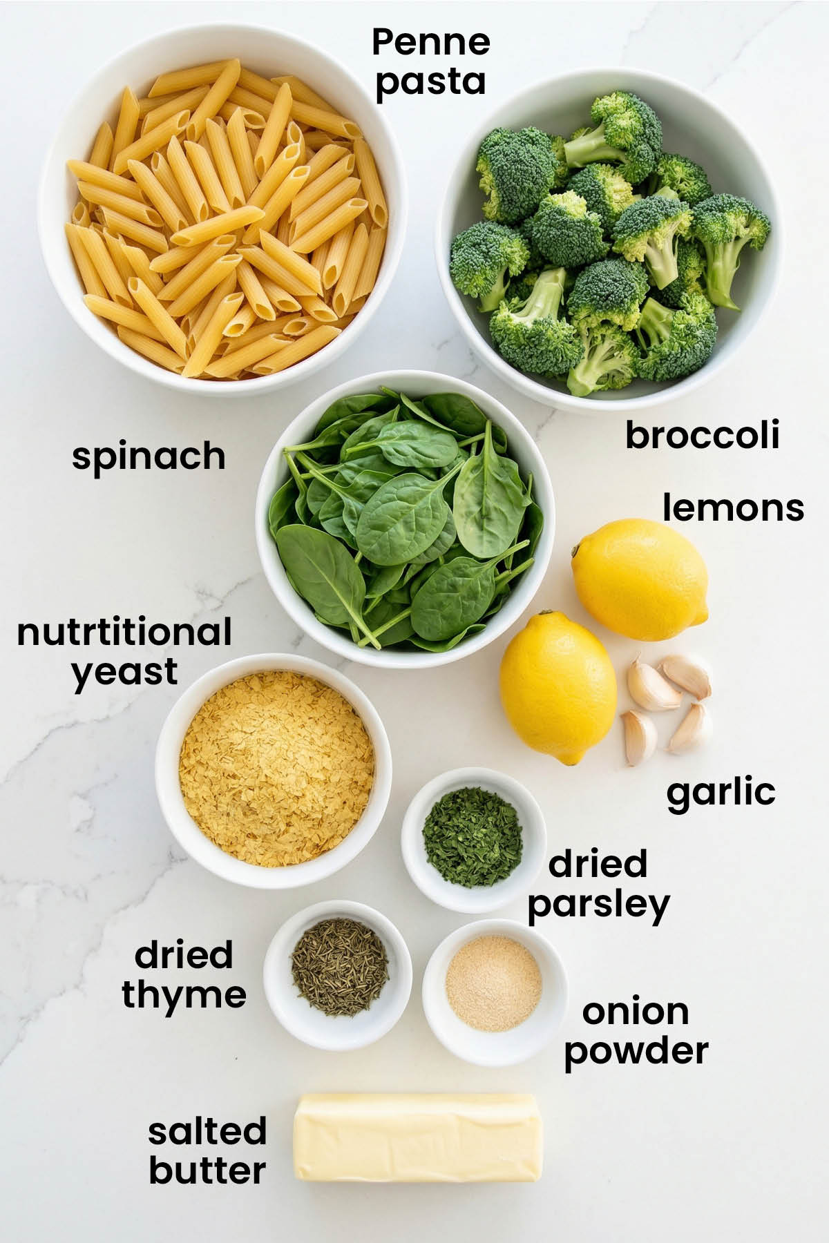 individual ingredients for baked butter lemon pasta without cheese laid out against a white background.
