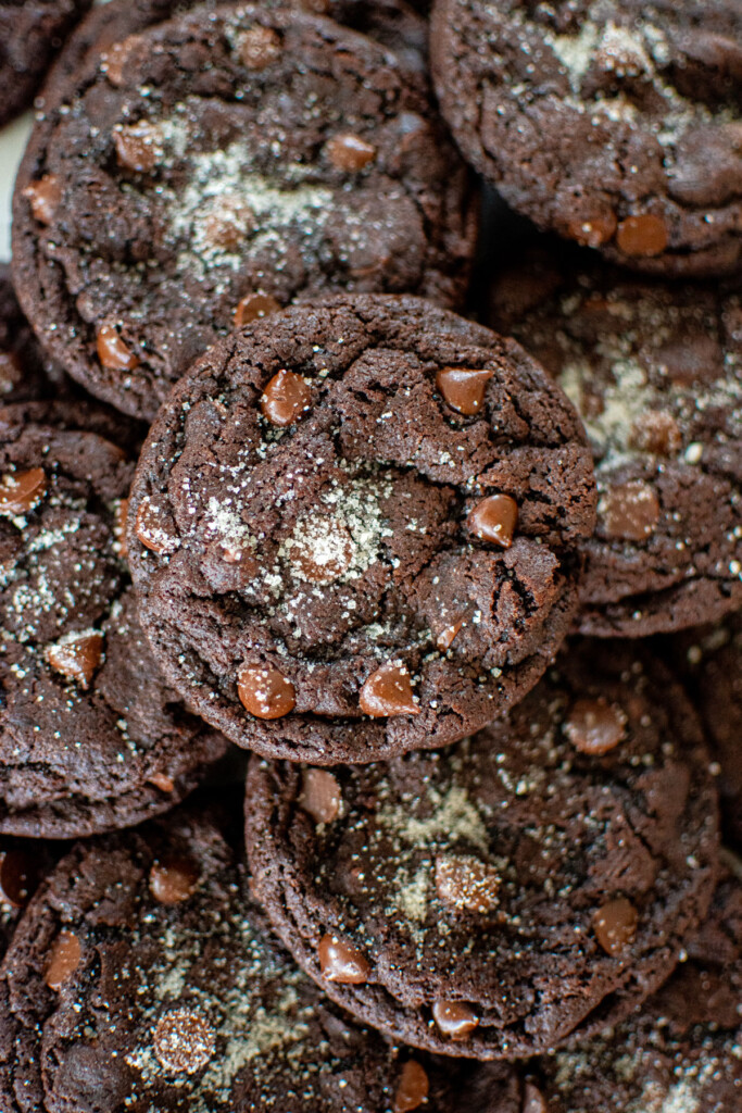 eggless chocolate chocolate chip cookies in a pile.