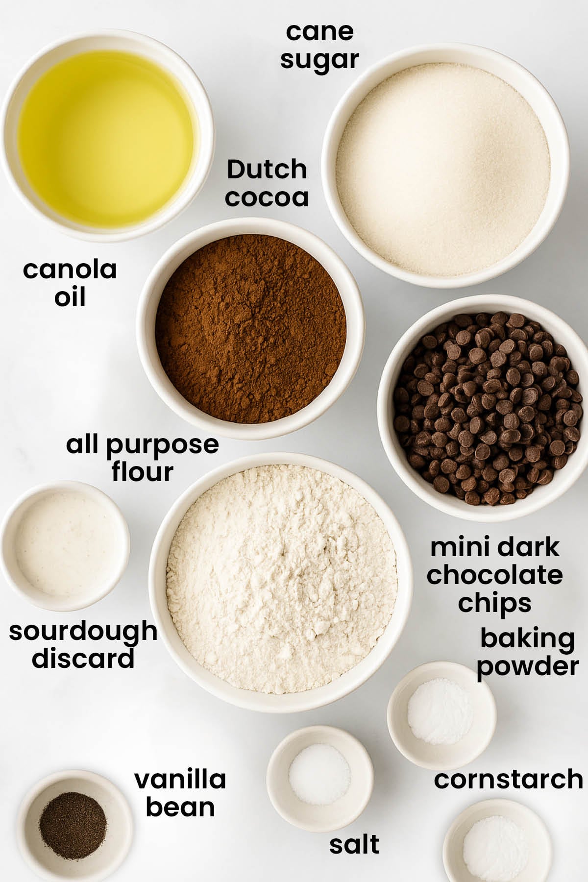 individual ingredients for sourdough chocolate chip brownies laid out against a white background.