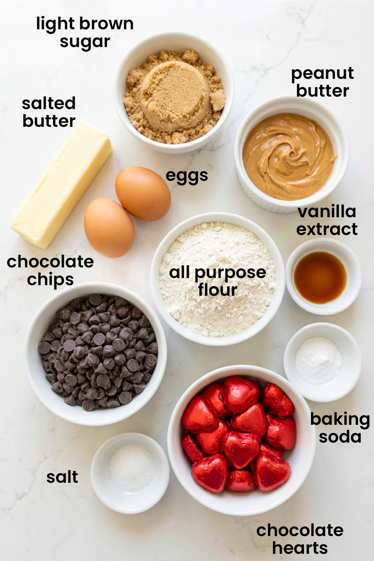 individual ingredients for valentine's day peanut butter cookie skillet laid out against a white background.