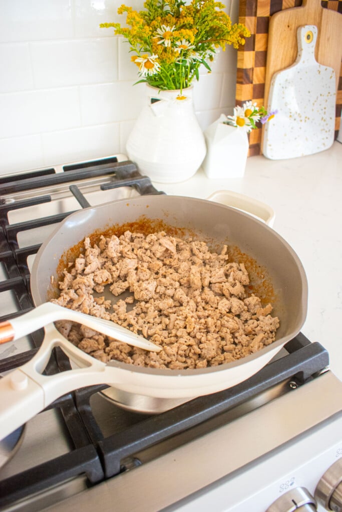cooked ground turkey in a skillet on the stovetop.